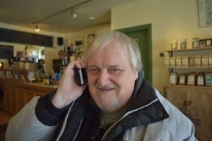 Bob Carswell at Birds & Beans Cafe in Mimico, close to Lake Ontario, where he met with Peter Mearns and Jaan pill in February 2015. In the photo, Bob is listening to the MCHS school song on Jaan's iPhone. Jaan Pill photo