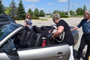 We were all set to take a photo of (left to right) Gina (Davis) Cayer, Lynn (Hennebury) Legge, and Scott Munro in the back seat of Lynn's Mustang, but then we discovered a baby car seat was already occupying the seat! Jaan Pill photo
