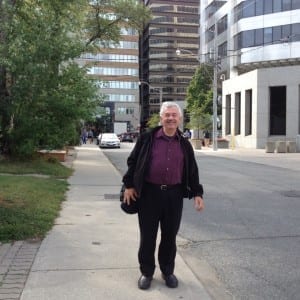 Walter Psotka on Alvin Avenue, on his way to Walter Psotka Photography at 39 Alvin Avenue just east of Yonge Street. In the background you can see St' Clair Avenue. Jaan pill photo