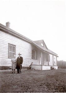 Nell and Robert Christopherson at the back of the Samuel Smith house, where they lived until 1952; the house was torn down in 1955. 