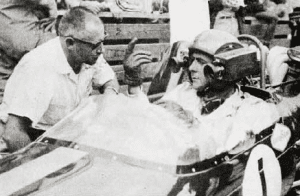Grand Prix Canada 1967: Robert Brooks CSC, at that time Chetwynd Film's Photography Director (and now President of Robert Brooks Associates) gives instructions to Jack Brabham on the operation of Chetwynd's helmet camera.