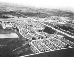 Caption: Ajax, Ontario, 1951. Most of the housing shown here was built during World War II by Wartime Housing Limited. Source: Ontario Archives. The photo is featured in an Urban History Review 1986 article by Jill Wade entitled: "Wartime Housing Limited, 1941 - 1947: Canadian Housing Policy at the Crossroads."
