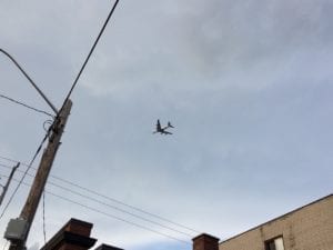 On a walk around July 31, 2017 by the corner of Fortieth St. and Lake Shore Blvd. West, I noticed a phenomenon quite distinct from the issue of parking at the corner. I noticed a jet flying to Pearson Airport. The jets were fling quite low. I became interested in getting as much of a jet into the picture frame of my iPhone, as i could, as the jets proceeded to fly overhead.