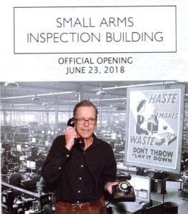 The photo is from the Snaptique Photo Booth, which was set up at the east windows of the room where the Small Arms Inspection Building Official Opening took place on June 23, 2018. At the booth, people (such as myself, in the photo) could choose from a variety of historical artifacts. In my case, I chose a rotary-dial telephone, of a kind that I remember from my childhood in Montreal in the 1950s.