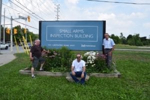 Left to right, Ted Long, Patrick Long, and Garry Burke outside Small Arms Inspection Building at Dixie Road and Lakeshore Road East, Aug. 5, 2018. Jaan Pill photo.