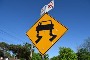 In Toronto, you can still find some vintage Slippery When Wet Signs. The newer version of the sign has graphic representations of snow in the space above the car. Jaan Pill