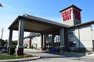 The Stay Inn is located at the corner of the East Mall and Evans Ave. In  the photo, Evans Ave. is in the background. The East Mall is outside of the frame, on the left.