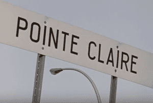 The fim describes how in Pointe Claire on the Island of Montreal, in accordance with the Quebec law regarding signage across the province, a hyphen had to be added between the words appearing on signs in all public places, as Point-Claire (with the hyphen) is the French version of the spelling and Point Claire (no hyphen) is the English version. 